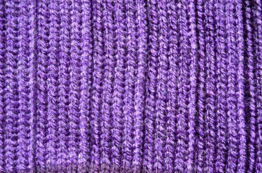 Yünden desenli kumaş. El yapımı kumaş mor yün arkaplan dokusu