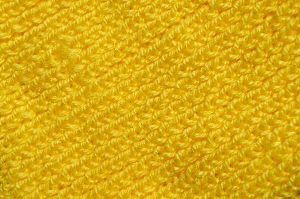 Yünden desenli kumaş. El yapımı örgü kumaş sarı yün arkaplan dokusu