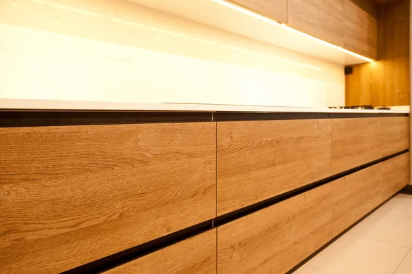 Modern brown wood lacquer paint and oak kitchen big cabinet equipment, luxury in a home