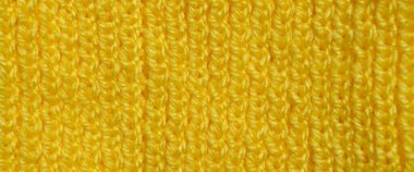 Yünden desenli kumaş. El yapımı örgü kumaş sarı yün arkaplan dokusu