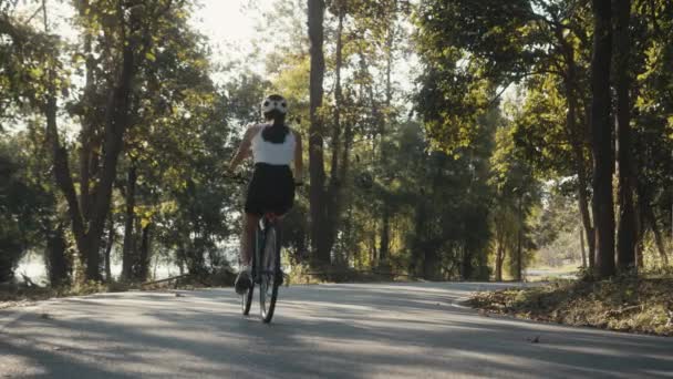 Cyclist girl training. Cyclist Woman in Helmet on Bike — Stock Video
