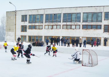 Atheletic game of hockey on open skating rink