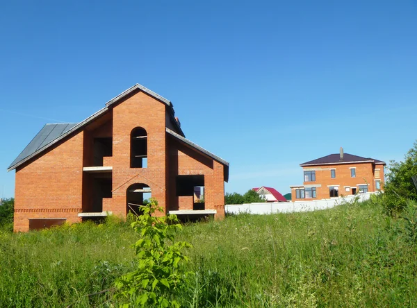 Construction of the new cottages from red brick — Stock Photo, Image