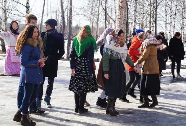 Young people on holiday of the shrovetide in national suit — Stock Photo, Image