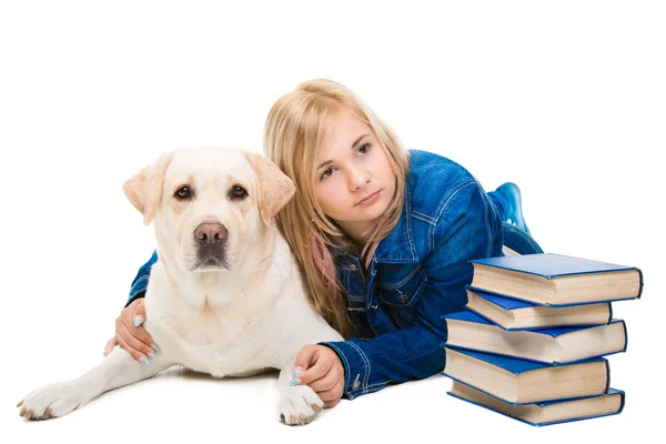 Girl reading a book with Labrador retriever on isolated white — Stock Photo, Image