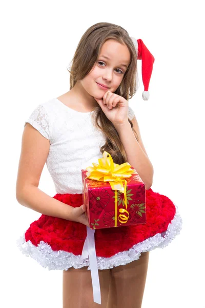 Girl with red Christmas cap and present on isolated white — Stock Photo, Image