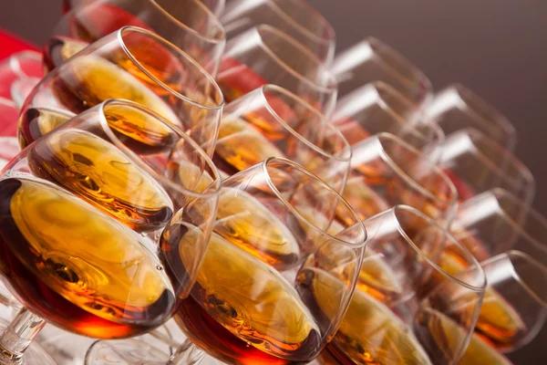 Glasses of cognac on festive table — Stock Photo, Image