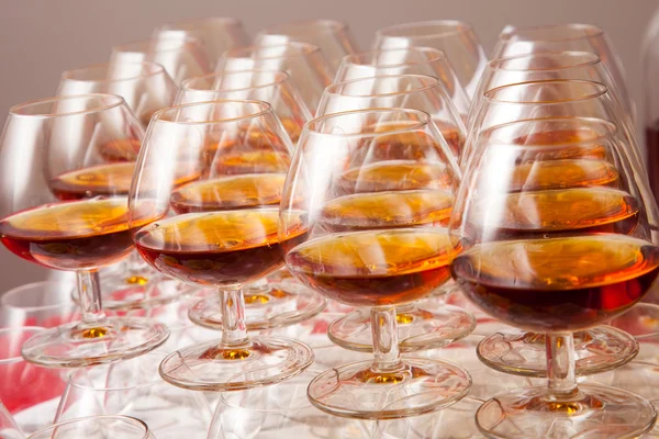 Glasses of cognac on festive table — Stock Photo, Image