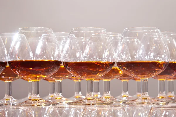 Glasses of cognac on festive table Stock Image