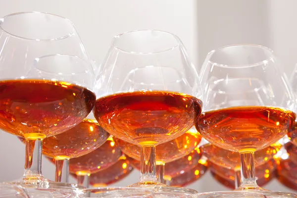 Glasses of cognac on festive table Stock Photo