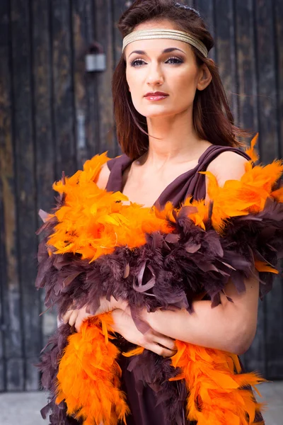 Girl in brown and orange boa — Stock Photo, Image