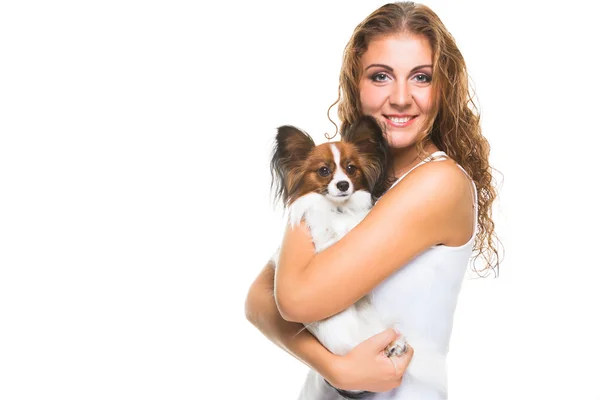 Beautiful girl with cute papillon dog on isolated white — Stock Photo, Image