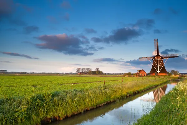 Dutch windmill at sunrise — Stock Photo, Image