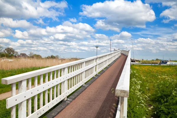 Long white bridge over river — Stock Photo, Image
