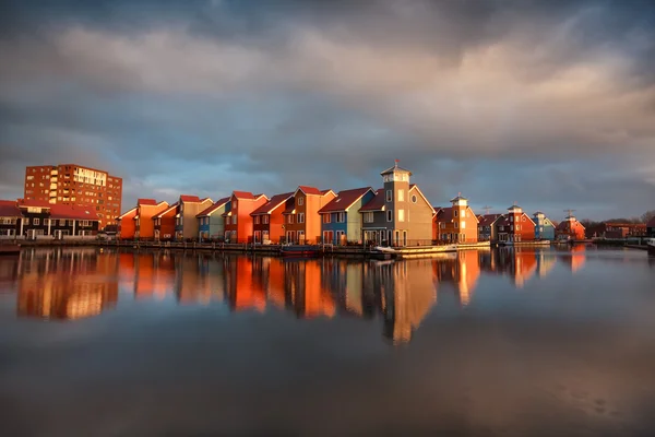 Beautiful colorful buildings on water in Groningen — Stock Photo, Image