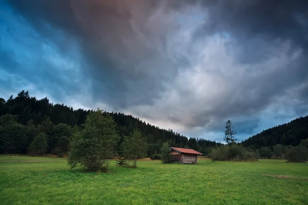 Stormy sunset over alpine meadows — Stock Photo, Image