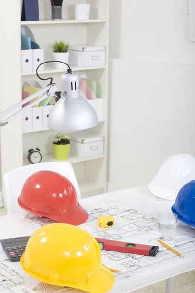 Hardhat and measuring instruments on blueprint — Stock Photo, Image