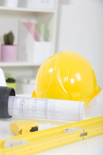 Hardhat and measuring instruments on blueprint — Stock Photo, Image