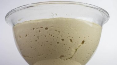 Closeup 4k video of yeast dough increases, time lapse. High quality 4k footage
