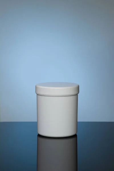 White Cosmetic Jar Mokup Reflection Light Blue Background Spot Light — стоковое фото