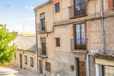 Typical facades of old houses in the city of Toledo in Spain
