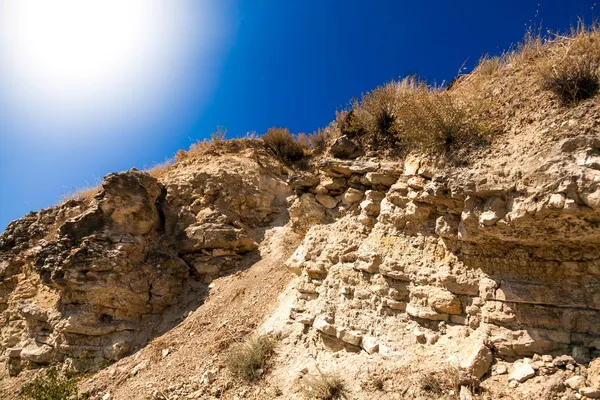 Sol brilhando acima de clifs — Fotografia de Stock