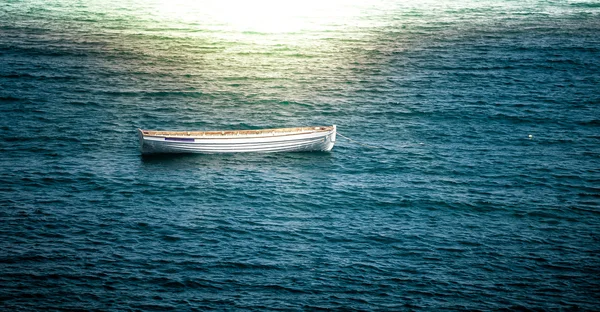 Lonely boat floating on waves — Stock Photo, Image