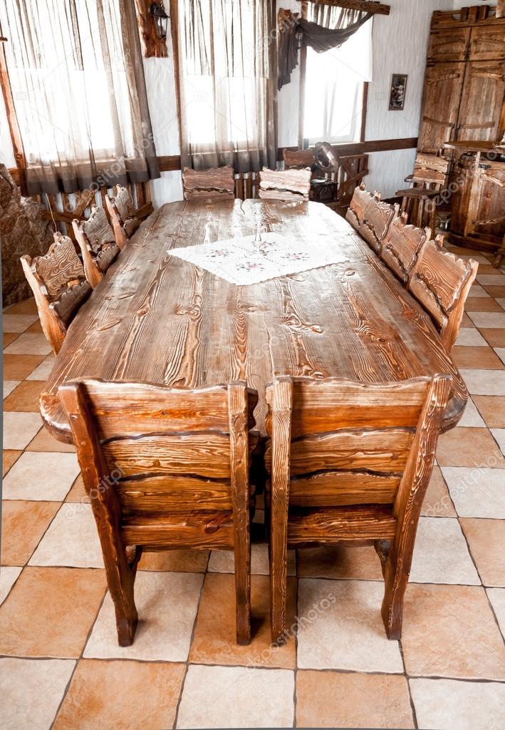 Round table in dining room with wooden chairs