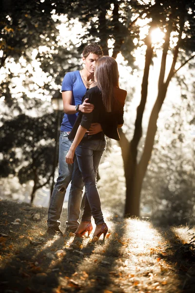 Couple in love hugging against park view — Stock Photo, Image