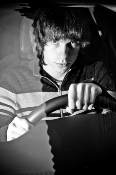 Portrait through windscreen of man on drivers seat — Stock Photo, Image