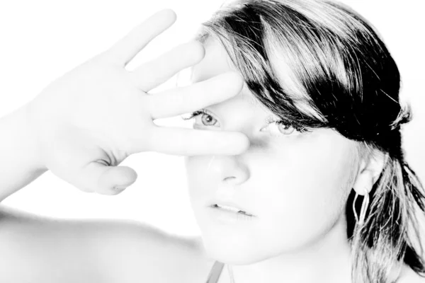 Portrait of woman covering eyes from light with hand — Stock Photo, Image