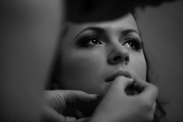 Portrait of makeup artist painting models lips — Stock Photo, Image