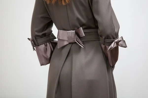 Back of the women coat with silk bow — Stock Photo, Image