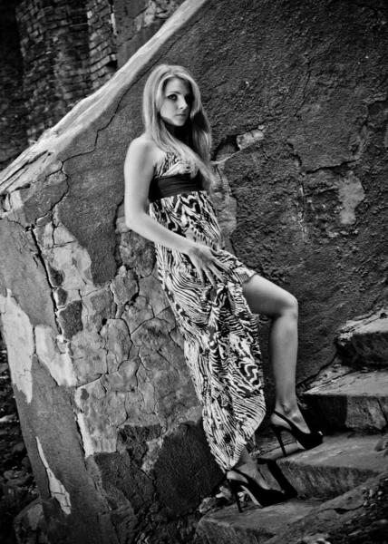 Full length portrait of slim woman posing on old stairway — Stock Photo, Image