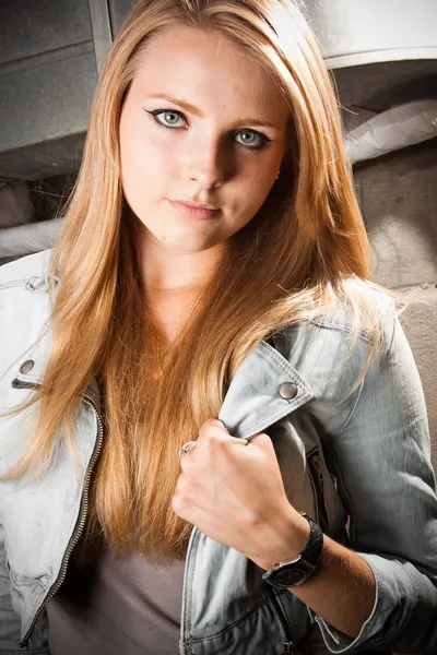 Portrait of sexy blonde student on jean jacket looking at camera — Stock Photo, Image