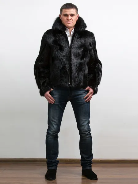 Handsome man wearing winter coat from natural beaver fur — Stock Photo, Image