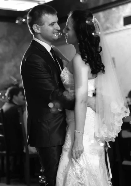 Groom hugging bride during dancing at restaurant — Stock Photo, Image