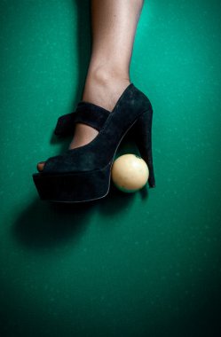 White billiard ball stuck in high heel black shoe clipart