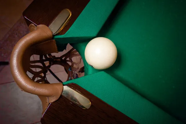 Shot of white ball going in billiard pocket — Stock Photo, Image