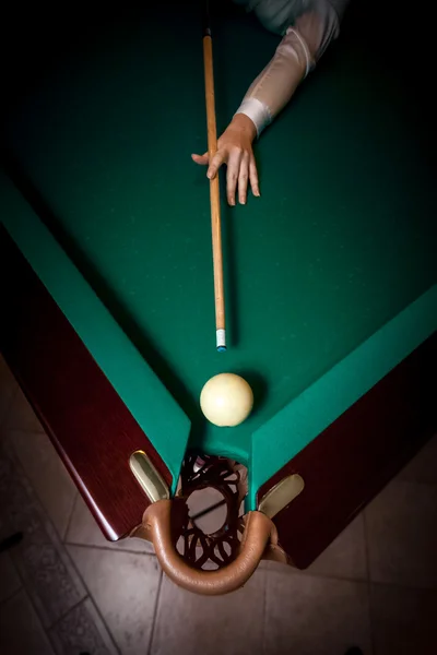 Woman aiming at billiard pocket with white ball — Stock Photo, Image