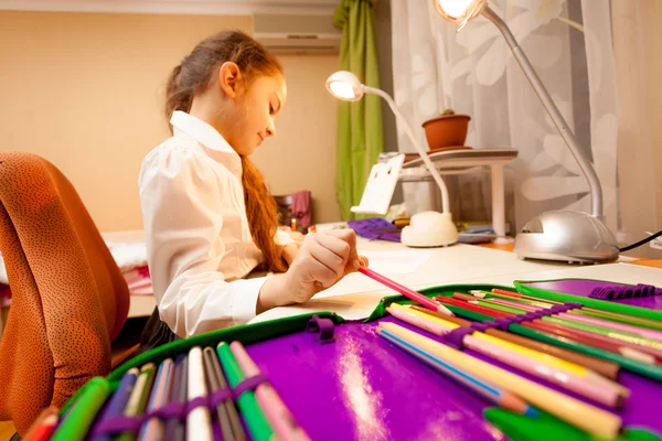 Little girl taking pencil of pencil-case — Stock Photo, Image