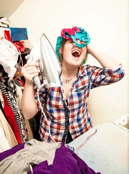 Woman singing and having fun during ironing — Stock Photo, Image