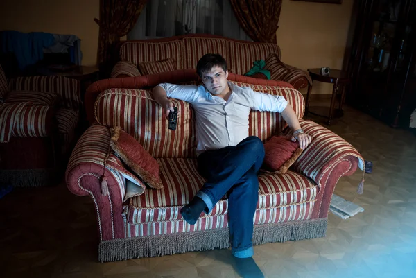 Relaxed man watching TV at living room at night — Stock Photo, Image