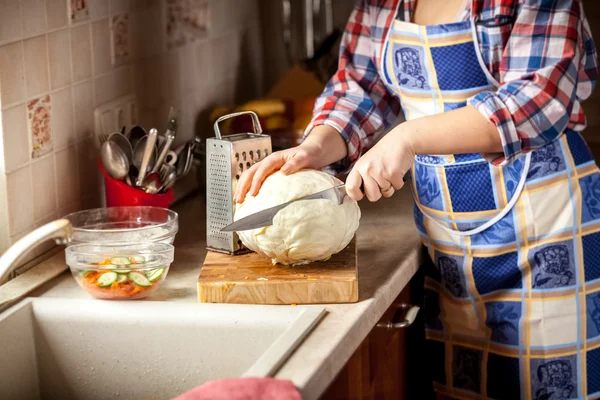 Photo of woman cutting cabbage on kitchen — Stock Photo, Image
