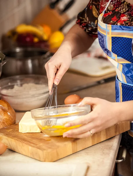 Photo of woman mixing eggs in glass bowl — Stock Photo, Image