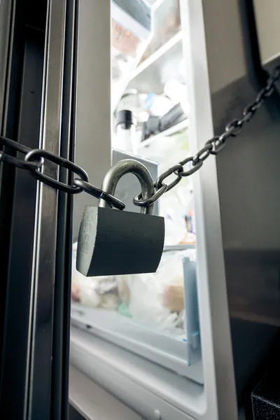 Photo of lock hanging on refrigerator — Stock Photo, Image