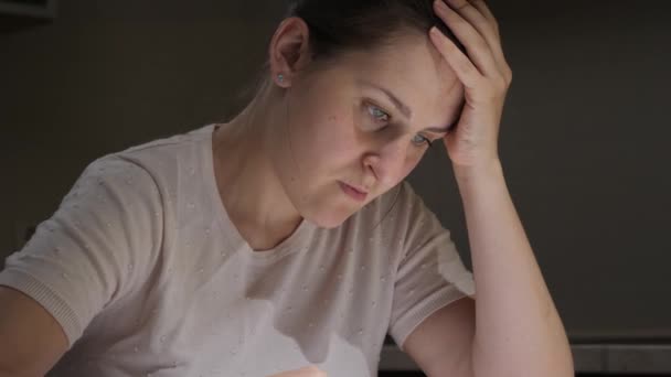 Portrait of stessed woman feeling frustrated while reading documents of divorce. Concept of financial difficulties, bankruptcy, taxes and rent payment. — Stock Video