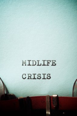 Midlife crisis text written with a typewriter. clipart
