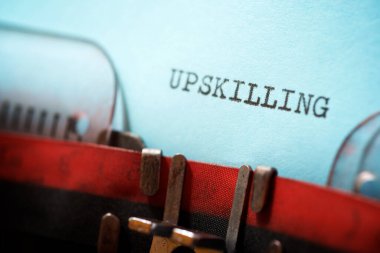 Upskilling word written with a typewriter. clipart