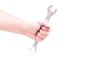 Stüdyo ışıkları. Bir insan eli. Beyaz arkaplanda anahtar.